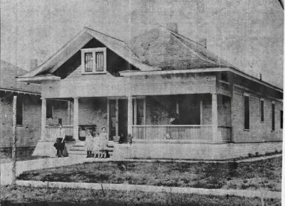2009 Fairmount 1913
Contributed by Sue Stevens.  Her grandmother and mother are on the porch swing, aunts and uncles are kids in the yard.
